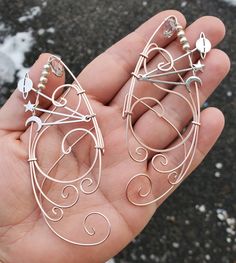 Planet, Moon and Stars Rose Gold COLOR (artistic wire) You will receive a right and a left with this order. This is made to order in 3 to 5 business days of purchase. Elf ear cuffs are lightweight, stylish and one size fits all. You'll find a pair that is suitable for any event be at the Renaissance Fair, a fairy festival, or just a fun night out on the town! All Elf Ear Cuffs are made with artistic wire, silver plated non-tarnish copper, Nickel free. All Cuffs come as a set and easily fit any s Goth Hippie Aesthetic, Aries Drawing, Star Elf, Wire Wrapped Star, Elf Ear, Elf Ear Cuff, Ear Cuff Jewelry, Fairy Festival, Hippie Aesthetic