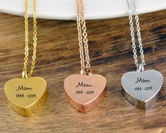 three heart shaped necklaces with names on them