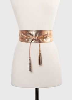 Stylish rose gold belt without buckle handmade in our atelier with high quality soft metallic leather. This glamorous obi belt has two small tassels at the end of the ties. It combines with blouses, pants, tunics, skirts, jeans, long baggy shirts, and all kinds of dresses. Available in three sizes and also in other metallic leather colors. See color options. ##MEASURES: Width in all sizes (Widest part): 3 inches/8 cm. MEDIUM From S to M international sizes. From 2 to 10 US sizes. This obi belt f Elegant Belted Sashes For Party, Elegant Gold Belt For Party, Adjustable Gold Belt For Evening, Adjustable Gold Party Belt, Adjustable Party Sashes, Gold Belts With Sashes For Parties, Elegant Gold Belt With Sashes, Elegant Fitted Sash With Belt Included, Gold Belts With Sashes For Formal Wear