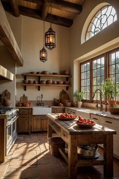 a kitchen filled with lots of counter top space and wooden shelves next to a window