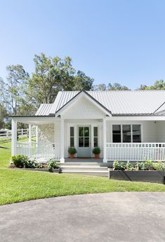 a white house with a porch and front door