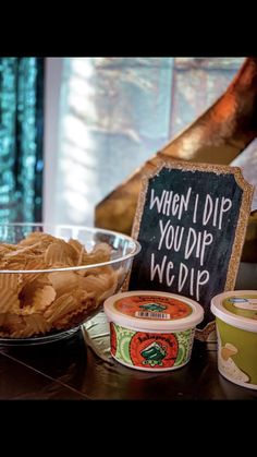 some food that is on a table with a chalkboard sign in front of it