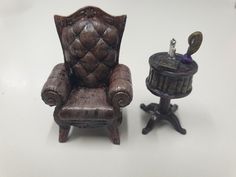 a miniature chair next to a small table