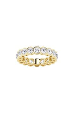 Bezel-set lab-created diamonds illuminate a sparkling eternity band ring crafted from polished 14-karat white, yellow or rose gold. Total lab-created diamond weight: 4.0ct. Color: G+ Clarity: VS–SI 14k white, yellow or rose gold/lab-created diamond Imported Diamond Guide Dazzling White Eternity Band With Brilliant Cut, Dazzling White Brilliant Cut Eternity Band, Halo Round Eternity Band In Fine Jewelry, Fine Jewelry Eternity Band With Halo, Fine Jewelry Halo Eternity Band, Classic White Eternity Band With Halo, White Halo Eternity Band Fine Jewelry, Classic White Halo Eternity Band, White Diamond Eternity Band With Round Cut