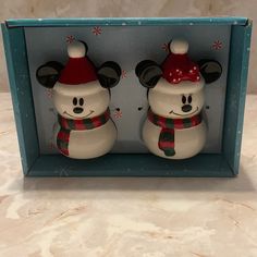 mickey and minnie mouse salt and pepper shakers in a blue box with snowflakes