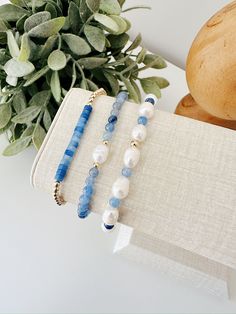 Treat yourself to a touch of luxury with our hand beaded bracelet set. Crafted with care and attention to detail, this bracelet  set boasts a stunning mix of gold filled beads, genuine fresh water pearls, and beautiful blue Aventurine gemstones. Perfect for adding a pop of color and sophistication to any outfit. Details: Bracelet 1: 3mm gold filled beads and Aventurine gemstones  Bracelet 2: Mix of Fresh water pearls and  3mm Aventurine gemstones Bracelet 3: Fresh water pearl focal bead and 3mm Aventurine Bracelet, Blue Aventurine, Handmade Silver Jewellery, Beads Bracelet Design, Beaded Jewelry Designs, Crystal Beads Bracelet, Fresh Water Pearls, Gemstone Beaded Bracelets, Beaded Bracelets Diy