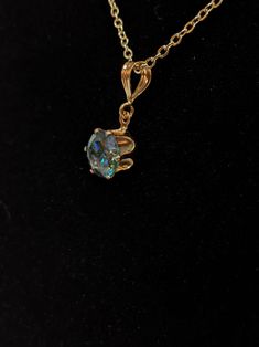 Description: This beautiful dark cyan blue(deep ocean blue) Moissanite is set in a  strong 6 prong gold  setting.  The dangle design of the pendant gives the moissanite  stone  freedom of movement which  allows the the radiance and sparkle of the moissanite diamond which they are so famous for to  really shine and sparkle. The  dangle pendant design is very comfortable to wear and shows the stone off nicely. This necklace makes a great present for any sweetheart, mom, daughter, niece,  Grandmom Blue Crystal Pendant Necklace, Elegant Blue Pendant Crystal Necklaces, Blue Gemstone Symbolic Necklace, Blue Mystical Pendant Jewelry, Blue Faceted Crystal Necklace Gift, Girdles, Dark Cyan, Blue Moissanite, Cyan Blue