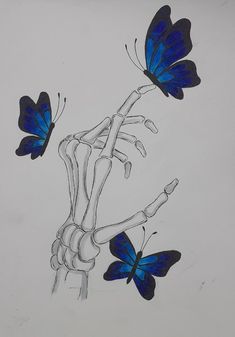 two blue butterflies flying over the top of a skeleton's arm and hand with bones attached to it