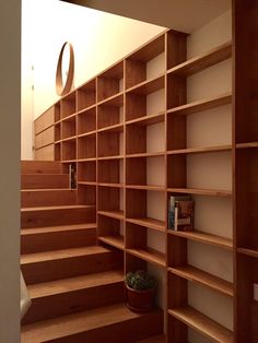 there are many bookshelves in the room and one is empty on the floor