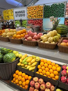 many different types of fruit in baskets on display