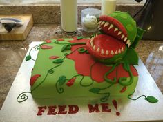 there is a cake that looks like a monster with teeth on it's face