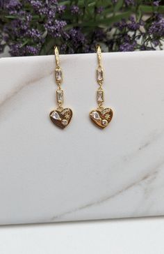 Micro Pave Decorated Heart Charm Dangle Earrings, Cubic Zirconia Crystal Earrings, Gold Rectangular Bezel Set Crystal Connectors Gold-plated and ultra-sparkly natural zircon crystals (a conflict-free and ethical gemstone)! These handmade earrings complement jeans and a T-shirt or are a great accent for an evening outing. The earring hooks are micro-pave gold-plated (gold-filled ear wires are available for an additional $6.00).   . Gold Dangle Heart Earrings With Cubic Zirconia, Gold Cubic Zirconia Heart Dangle Earrings, Gold Cubic Zirconia Dangle Heart Earrings, Elegant Heart Earrings With Dangling Charms For Valentine's Day, Elegant Valentine's Day Heart Earrings With Dangling Charms, Heart Charm Cubic Zirconia Drop Earrings, Cubic Zirconia Heart Charm Drop Earrings, Cubic Zirconia Heart Dangle Earrings For Gift, Valentine's Day Cubic Zirconia Dangle Heart Earrings