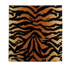 a black and brown animal print rug on a white background with the image of a zebra's stripes