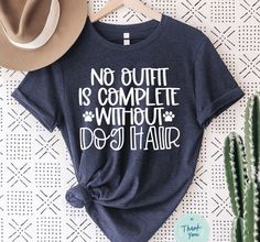 a t - shirt that says, no quitit is complete without a dog hair