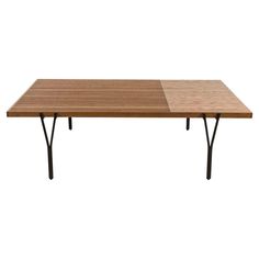 a wooden table with two black legs and a brown top on a white background,