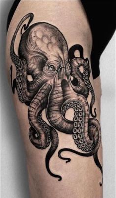 an octopus tattoo is shown on the thigh, with black and white ink in it