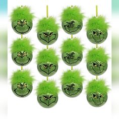 the grin face ornaments are green with fluffy feathers