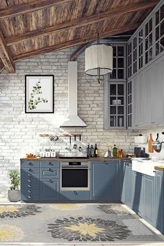 a kitchen with gray cabinets and an area rug