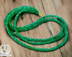 a green string with some beads on it