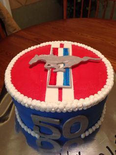 a red, white and blue cake sitting on top of a table