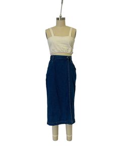 Cute basic jean skirt Vintage skirt made of dark wash indigo denim with a great longer length, belt loops and pockets.  Size  ~ US womens M Waist ~  14" Hips ~ 21" Length ~ 32" Condition ~ Good vintage condition steam cleaned and ready to wear ~ All vintage items may have minor imperfections upon close inspection Measurements taken flat across the front ~ Double where needed For more vintage and drop previews drops check out @shop.lesage on IG  For 20% off your first order sign up for the email list   https://mailchi.mp/5fb37bd36064/shop-lesage  (You may need to copy and paste the link into your browser)  Deterred by shipping fees?  I bundle shipping on all multi item orders and offer free shipping for social media posts Denim Maxi, Indigo Denim, Vintage Rock, Skirt Vintage, Jeans Rock, Jean Skirt, Dark Denim, Vintage Skirt, Wrap Skirt