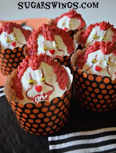 cupcakes with icing and decorations on them are arranged in the shape of a clown's head