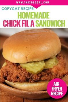 a close up of a chicken sandwich on a plate with text overlay that reads copycat recipe homemade chick fila sandwich