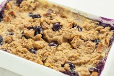 a casserole dish filled with blueberries and oatmeal