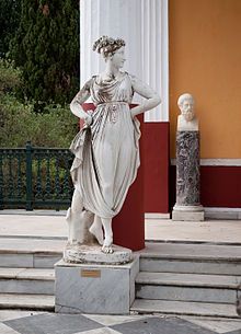 a statue is standing on some steps