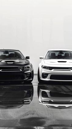 two black and white sports cars side by side