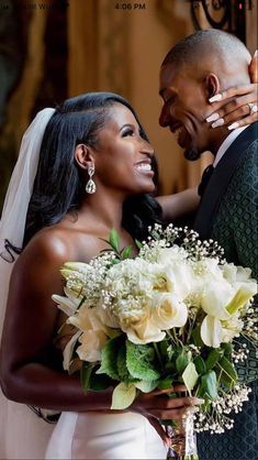 a bride and groom embracing each other