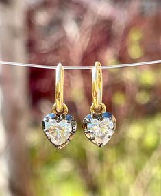 "Lower prices on our main website: https://discomarshmallow.myshopify.com/ A pair of beautiful hoop earrings with heart shaped moissanites. In Georgian cut-down settings, the heart moissanite Hoop earrings are handcrafted in blackened white and yellow gold, on small yellow gold hoops.  Item Details * Made to Order. * Gold Kt: 14K or 18K Solid Gold * Custom Gold Color: Rose Gold, Yellow Gold, White Gold * Cut: Heart * Setting Type: Georgian * Ready to Ship in 20-30 business days If you are intere Heart Shaped Diamond, Solid Gold Jewelry, Diamond Hoop Earrings, Gold Hoops, Jewelry Earrings Hoops, Gold Hoop, Diamond Heart, Gold Hoop Earrings, Gold Yellow