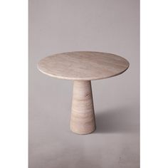 a round table with a wooden base on a grey background in the shape of a pedestal