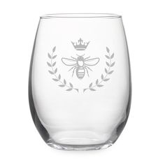 a glass with a bee and crown on it