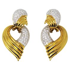 Spectacular pave diamond and 18 karat gold door knocker earrings. Featuring a grooved polished gold body with domed pave diamond embellishments, we love how these versatile beauties can be worn with or without the optional dangle. When worn alone, the top portion gently hugs the ear for a contoured, secure fit. When paired with the larger teardrop shaped dangle, the gentle movement reflects the diamonds from all angles, making them sparkle beautifully on the ear. These incredible earrings featur Gentle Movement, Door Knocker Earrings, Gold Door, Gold Bodies, Luxury Earrings, Jewelry Appraisal, Door Knocker, Antique Earrings, Door Knockers