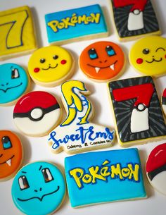 decorated cookies are arranged in the shape of pokemon