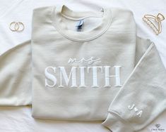 Our mrs sweatshirt is the perfect wedding gift or engagement gift! The new bride will be cozy yet cute while wedding planning or on her honeymoon in this minimalistic, embossed style sweater. Personalize the left sleeve with the initials of the couple to make it even more special -- a perfect keepsake for a beautiful time in her life. I T E M ∙ D E T A I L S * Crewneck Sweater, 50% cotton, 50% polyester * Unisex Sizing: S, M, L, XL, 2XL Care Instructions: Machine wash cold. Tumble dry low or han Bach Gift, Bride Sweater, Mrs Sweatshirt, New Bride, Womens Sweatshirts, Perfect Wedding Gift, Bridal Shower Gift, Style Sweater, Style Minimaliste