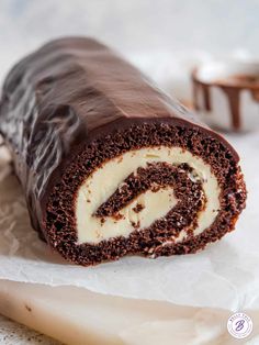 there is a chocolate roll with cream filling on the wrapper and it's cut in half