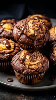 chocolate cupcakes with swirly frosting on a plate