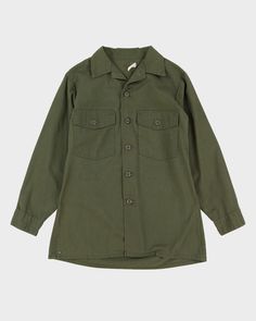 Genuine Military issue In overall very good condition with some minor wear. Some shadowing from removed patches. One replaced button on left pocket Khaki Button-up Tops With Side Pockets, Military Style Button-up Shirt With Pockets, Military Style Cotton Tops With Snap Buttons, Military Style Workwear Tops With Pockets, Military Style Tops With Pockets For Workwear, Cotton Uniform Shirt With Long Sleeves, Military Style Collared Tops With Flap Pockets, Military Cotton Top With Flap Pockets, Military Style Long Sleeve Tops With Flap Pockets