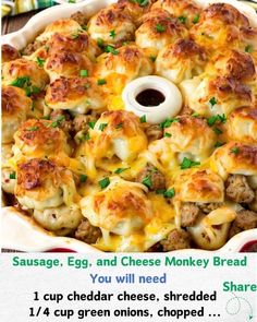 a casserole dish with sausage, egg and cheese monkey bread