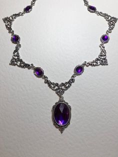 STUNNING FILIGREE VICTORIAN STYLE PURPLE SILVER PLATED NECKLACE FASTENS WITH TRIGGER CLASP. SILVER TONE NOT BRIGHT SILVER.   PENDANT APPROX  1.75 INCHES (4cm) INCLUDING BAIL LENGTH OF NECKLACE...16..INCHES (40cm)  AS SHOWN...OTHER LENGTHS AVAILABLE 18 20 22 24 longer lengths have more parts and stones MATCHING BRACELETS NOW LISTED Also listed as a set with earrings. (CHOICE OF 3 SIZES!) I AM LISTING necklaces and sets IN LOTS OF COLOURS see other listings Earring Sizes, Purple Stone Necklace, Metal Collar, Purple Acrylic, Fancy Necklace, Crystal Stones, Handcrafted Necklace, Silver Plated Necklace, Purple Stones