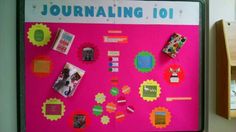 a pink bulletin board with pictures and magnets on it's side in a classroom