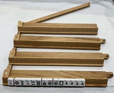 four wooden dominos sitting next to each other