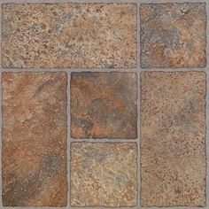 several different types of stone tiles arranged in a square pattern on a wall or floor