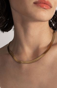 An '80s-inspired herringbone chain slinks around your neck in this shiny lariat necklace fixed with a slide closure to adjust the drop. 24" length Adjustable slide closure 18k-gold plate Imported Tarnish Resistant Herringbone Necklace For Formal Occasions, Adjustable Herringbone Snake Chain Necklace, Adjustable Yellow Gold Herringbone Necklace, Modern Herringbone Necklace, Tarnish Resistant, Gold Lariat Necklace, Herringbone Chain, The Drop, Lariat Necklace, Anniversary Sale