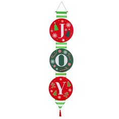 three christmas ornaments hanging from the side of a white wall with words joy on them