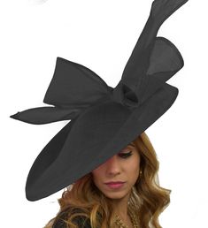 2015 Hats By Cressida British Birds Collection Barn Owl Fascinator Hat Gorgeous extra large sinamay flat hat trimmed with a modern take on a bow. Measures 48cm wide or about 19 inches We can make this in many different colours. If you prefer the bow to be a different colour to the base just state this when you pay. On a headband. Headband Colour: We always try and match the band to the fascinator. If we cant do this the band colour will be Black. If you dont wish a black band please supply an al Black Boater Hat With Flat Brim For Party, Fitted Black Boater Hat For Races, Black Boater Hat For Races, Fitted Flat Brim Party Hats, Fitted Cloche Costume Hat For Races, Black Boater Hat For Royal Ascot Party, Fitted Top Hat For Races At Royal Ascot, Black Boater Hat For Kentucky Derby Party, Fitted Top Hat With Curved Brim For Races