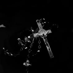 a black and white photo of a rosary