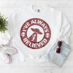 a white sweatshirt with the words live always and an image of a mushroom on it